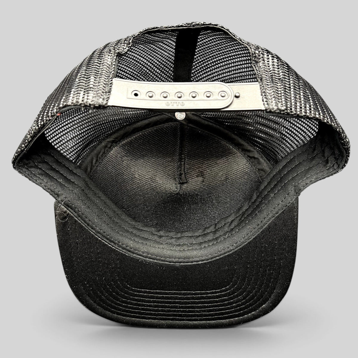 Raree Finds Cloud 10 Otto trucker hat interior view showing black mesh panels and adjustable snapback closure