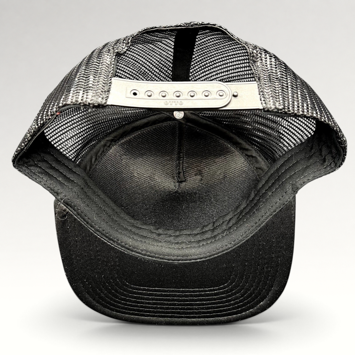 Raree Finds Cloud 10 Otto trucker hat interior view showing black mesh panels and adjustable snapback closure