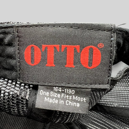 Raree Finds Otto trucker hat interior tag showing brand logo and manufacturing details on black mesh fabric