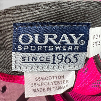 Raree Finds vintage Ouray Sportswear tag showing material composition and manufacturing details on a 90s snapback hat.
