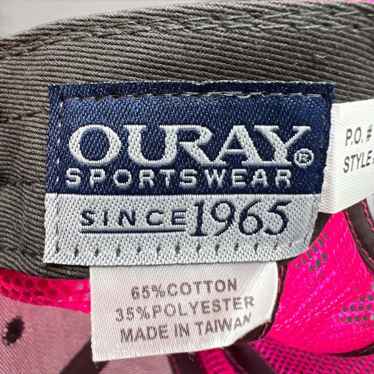 Raree Finds vintage Ouray Sportswear tag showing material composition and manufacturing details on a 90s snapback hat.