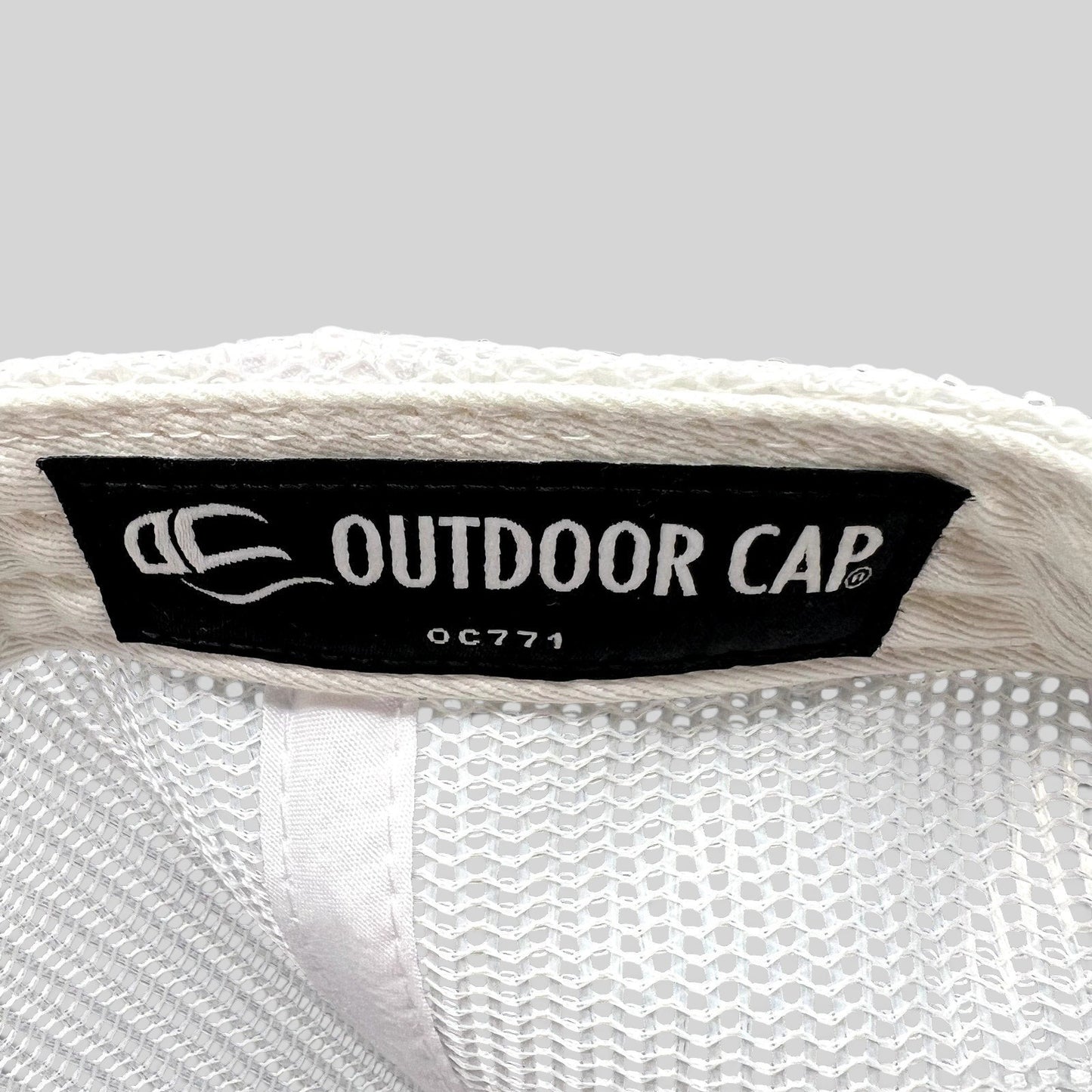 Raree Finds interior label of an Outdoor Cap OC771 trucker hat with white mesh lining
