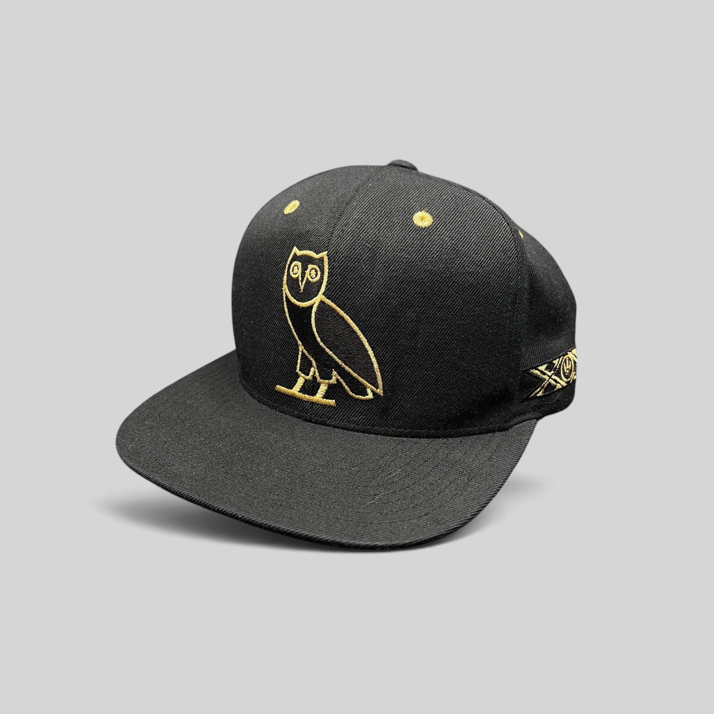 Raree Finds black and gold OVO owl snapback hat from the 2015 Toronto Raptors Mitchell & Ness collaboration