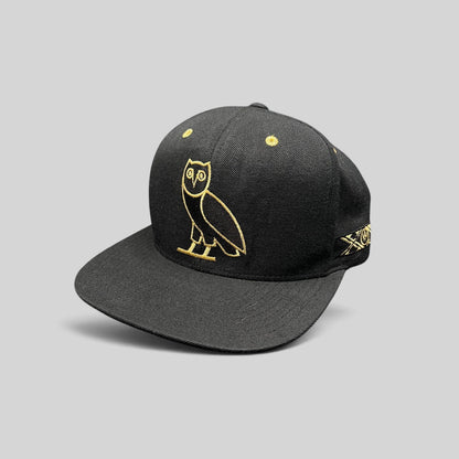 Raree Finds black and gold OVO owl snapback hat from the 2015 Toronto Raptors Mitchell & Ness collaboration