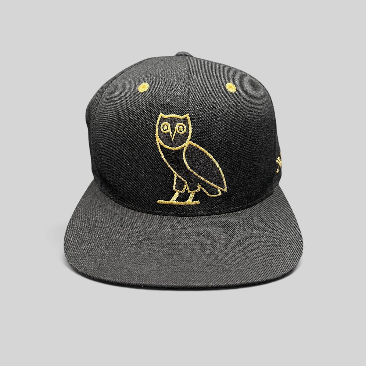 Raree Finds black and gold OVO owl snapback hat from the 2015 Mitchell & Ness Toronto Raptors collaboration