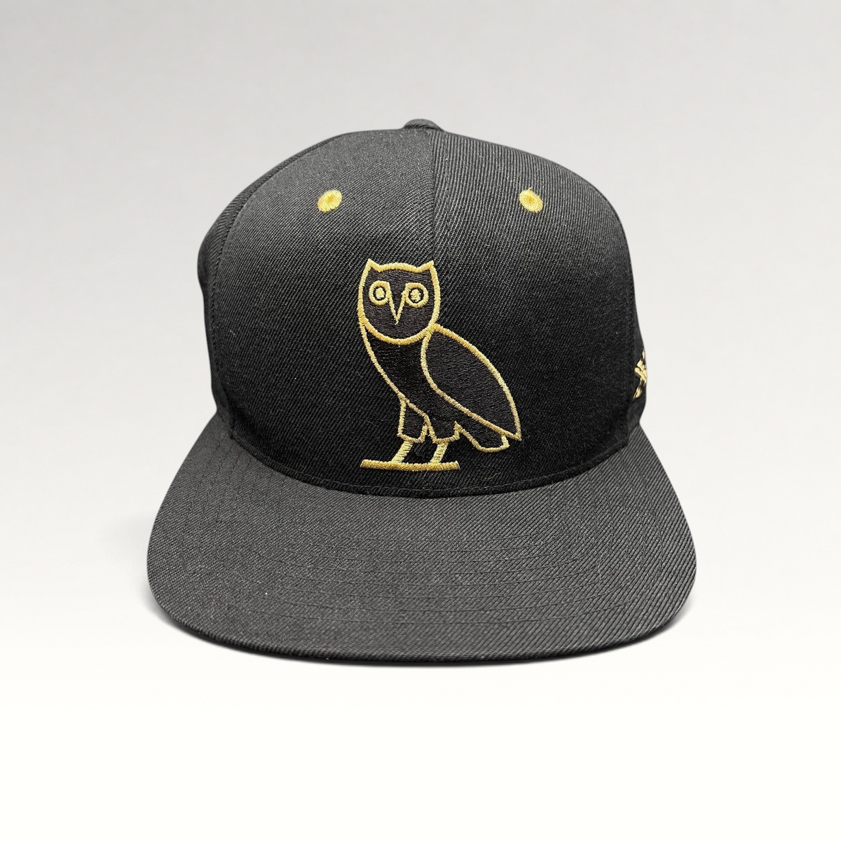 Raree Finds black and gold OVO owl snapback hat from the 2015 Mitchell & Ness Toronto Raptors collaboration