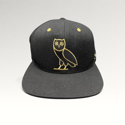 Raree Finds black and gold OVO owl snapback hat from the 2015 Mitchell & Ness Toronto Raptors collaboration