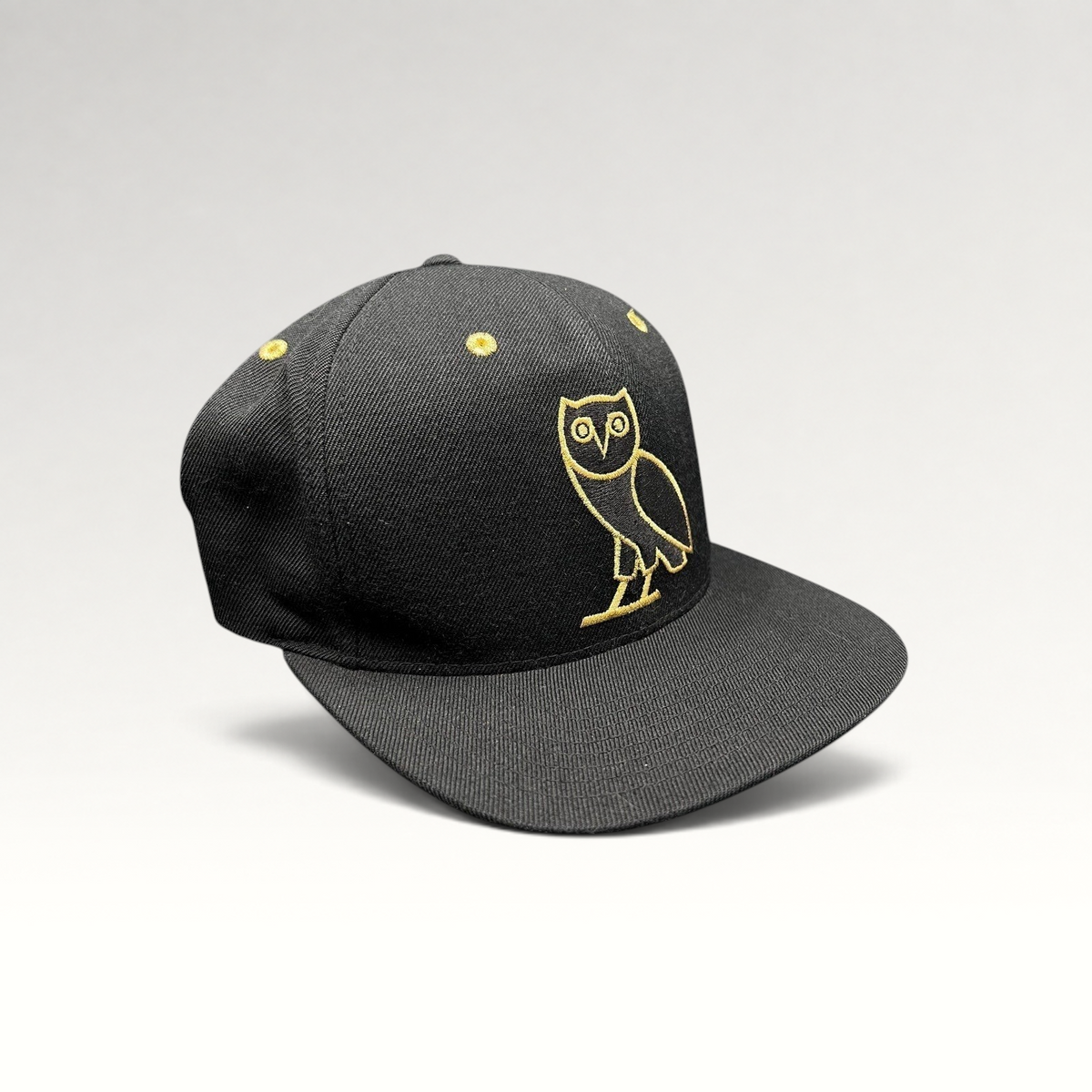 Raree Finds black and gold OVO owl snapback hat from the 2015 Toronto Raptors Mitchell & Ness collaboration