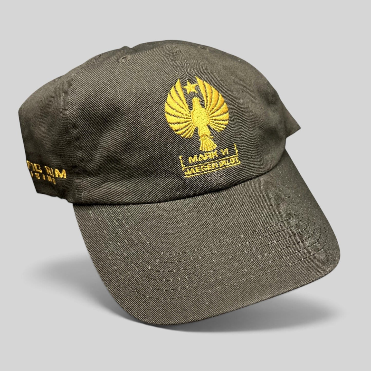 Raree Finds olive drab cotton strapback hat with gold embroidered Pacific Rim Uprising Jaeger Pilot insignia
