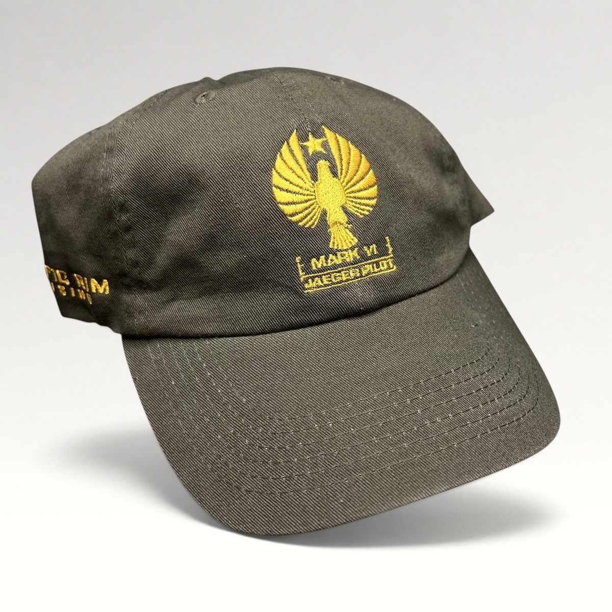 Raree Finds olive drab cotton strapback hat with gold embroidered Pacific Rim Uprising Jaeger Pilot insignia
