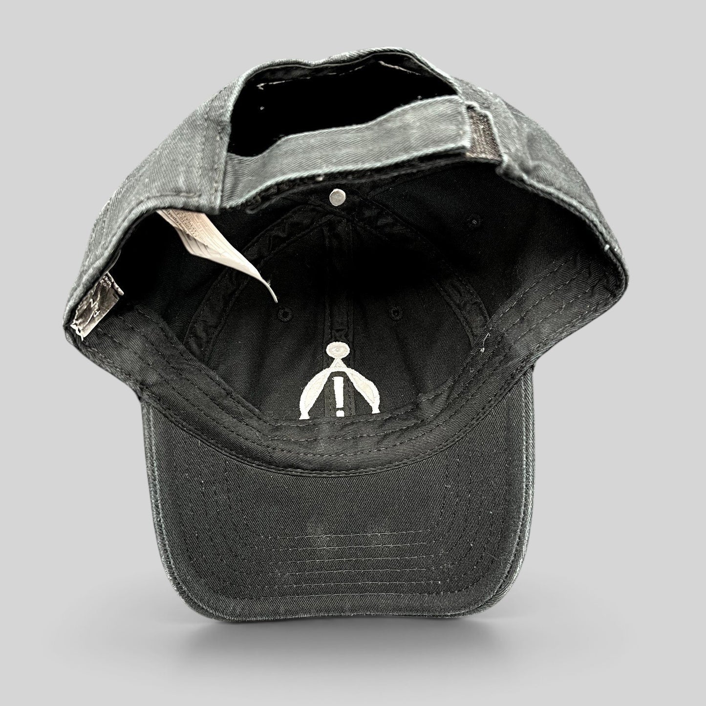 Raree Finds black cotton strapback hat with white embroidered Panic! At The Disco sigil on the interior crown