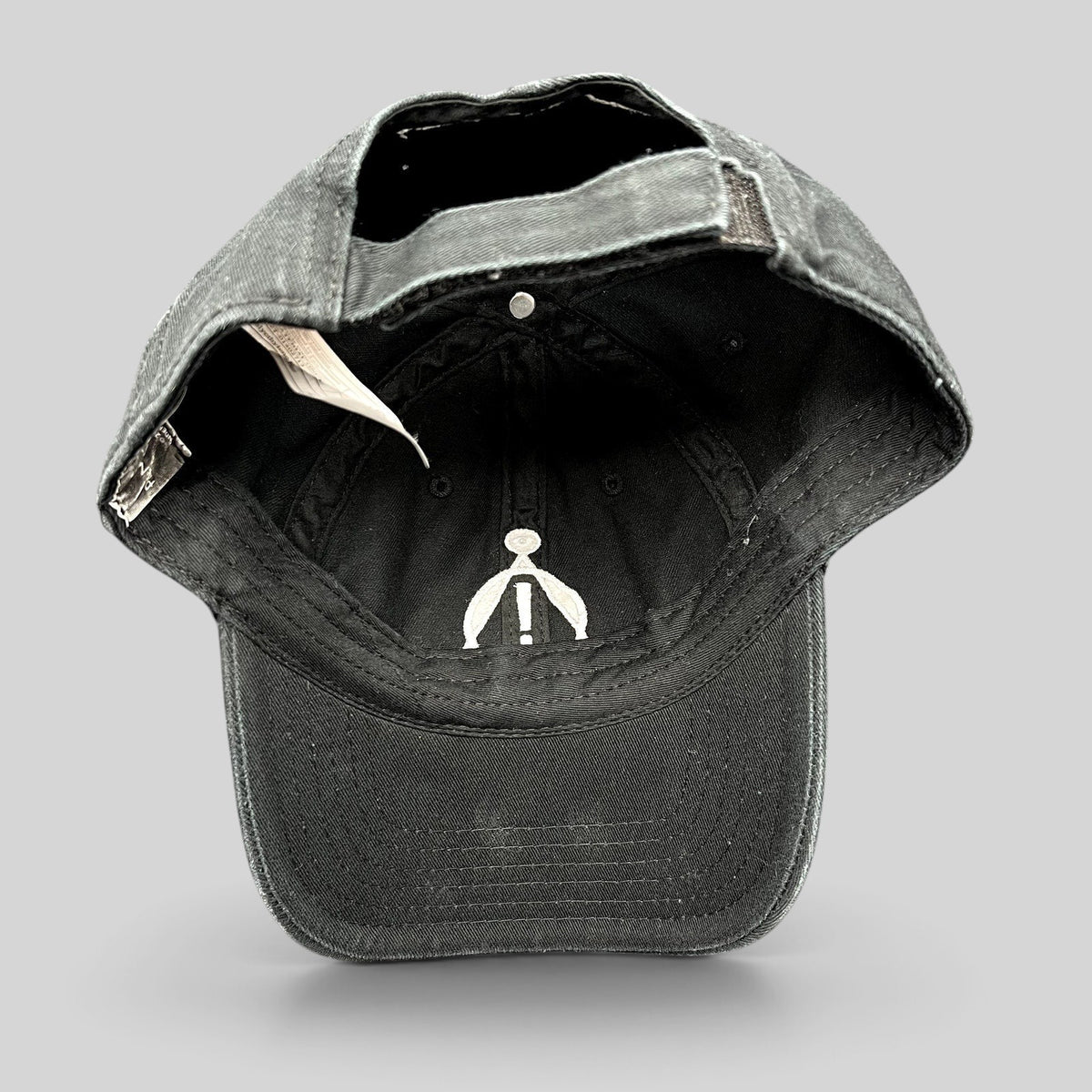 Raree Finds black cotton strapback hat with white embroidered Panic! At The Disco sigil on the interior crown