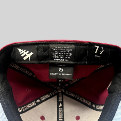 Raree Finds Paper Planes burgundy fitted hat interior showing size 7 1/2 tag and Greatness Is A Process taping