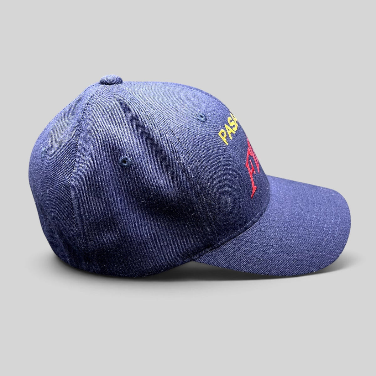Raree Finds navy blue Pasadena Fire department Flexfit hat with red and yellow embroidered lettering on the crown.