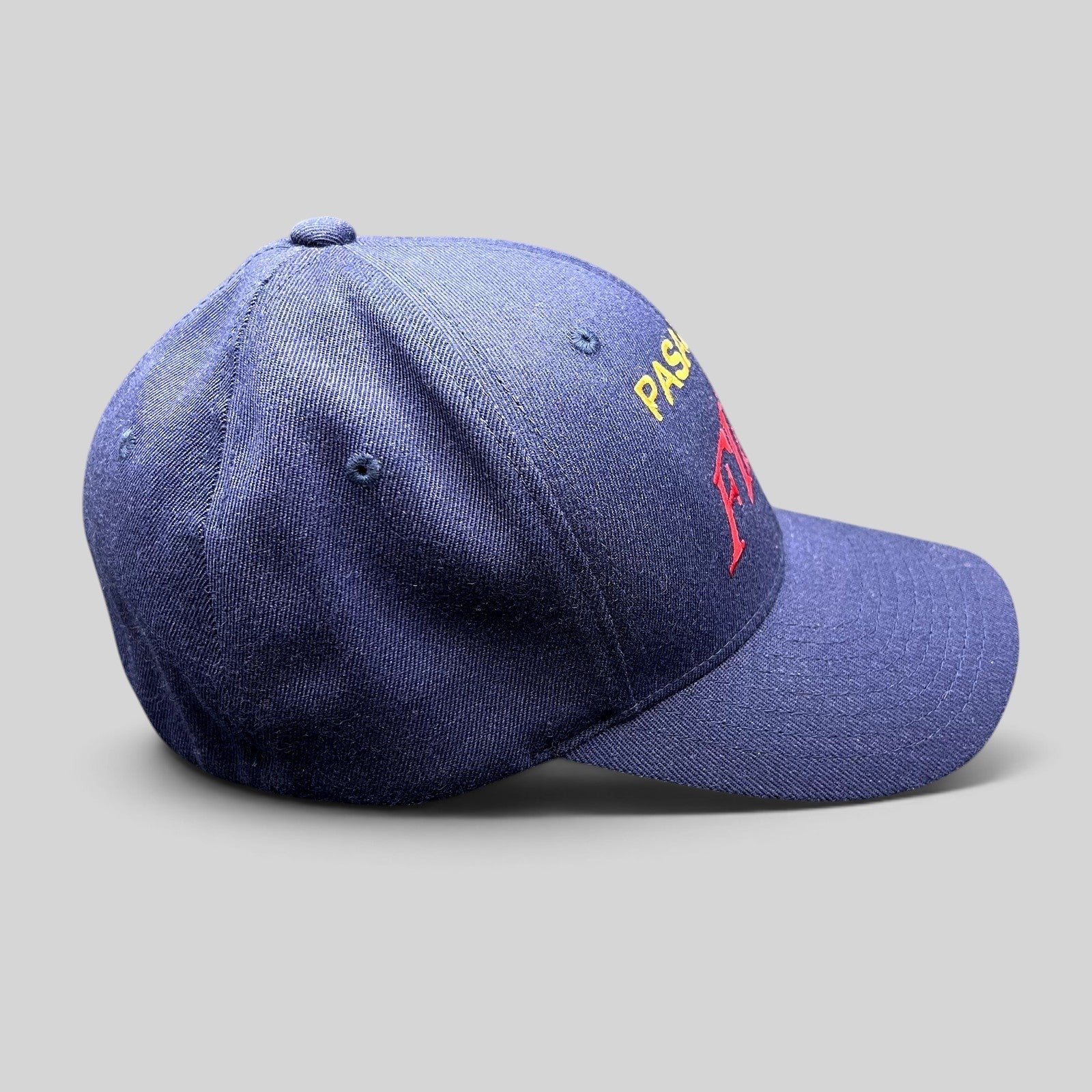 Raree Finds navy blue Pasadena Fire department Flexfit hat with red and yellow embroidered lettering on the crown.