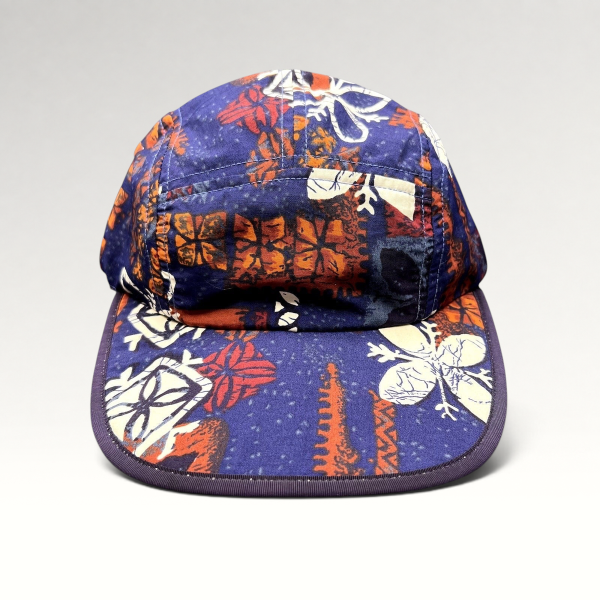 Raree Finds vintage 1996 Patagonia Spoonbill cap in purple with a vibrant tropical print and soft packable bill.