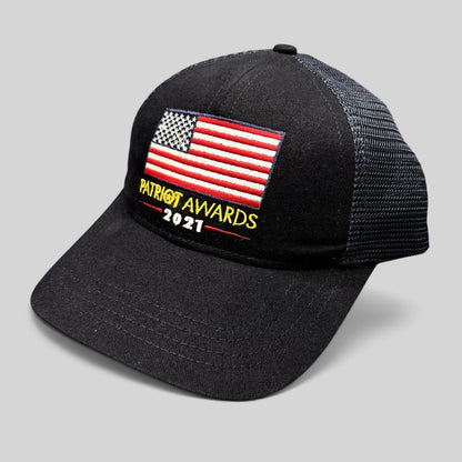 Raree Finds Patriot Awards 2021 navy and black trucker hat with embroidered American flag and structured mesh back