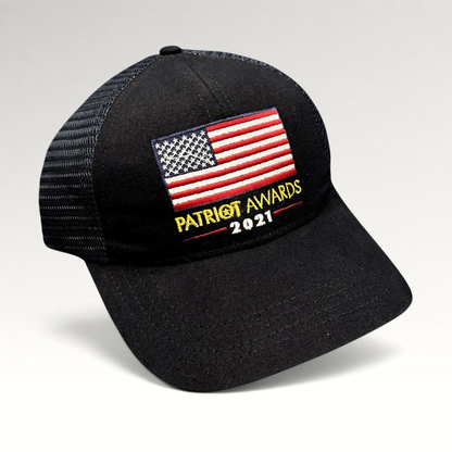 Raree Finds Patriot Awards 2021 black trucker hat with an embroidered American flag and structured mesh back design.
