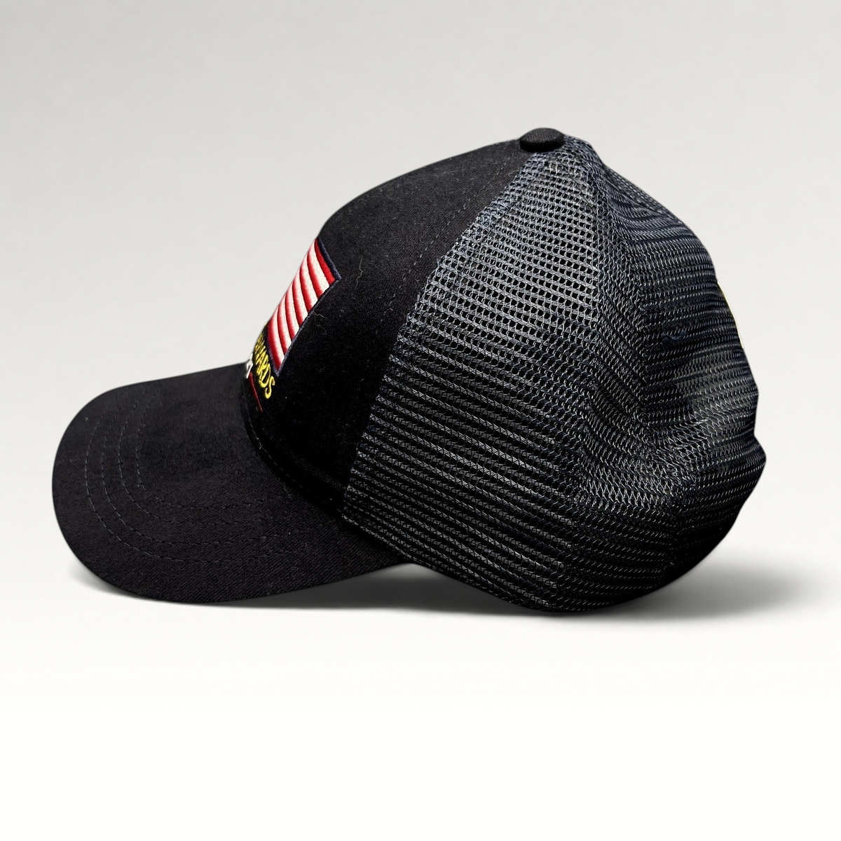 Raree Finds Patriot Awards 2021 navy and black trucker hat with embroidered American flag and mesh back