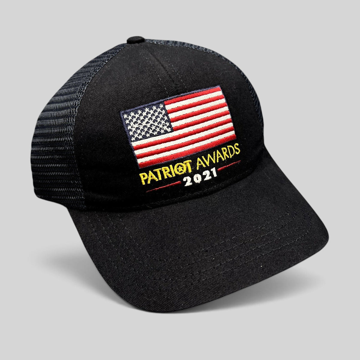 Raree Finds Patriot Awards 2021 black trucker hat with embroidered American flag and adjustable snapback closure