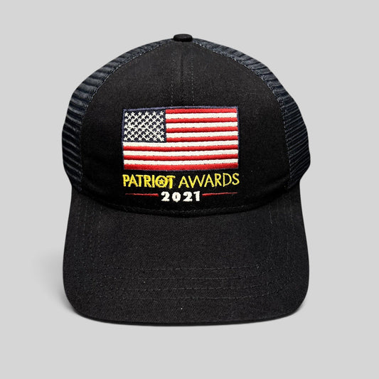Raree Finds navy and black trucker hat with embroidered American flag and Patriot Awards 2021 logo on front
