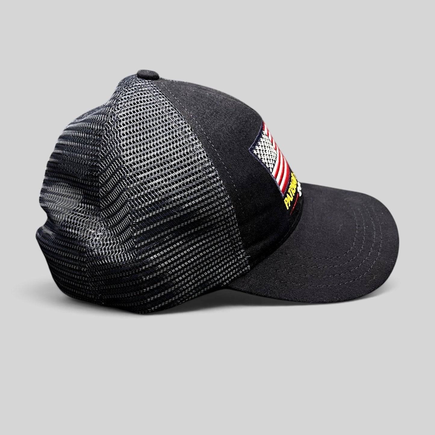Raree Finds Patriot Awards 2021 navy and black trucker hat with embroidered American flag and mesh back