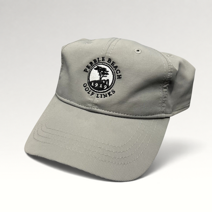 Raree Finds gray performance fabric golf cap with embroidered Pebble Beach Golf Links 1919 logo and strapback closure.