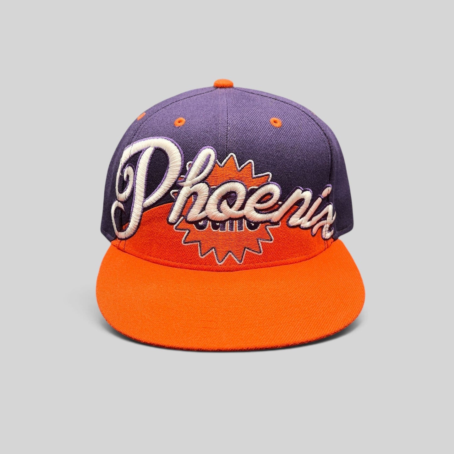 Raree Finds Phoenix Suns Hardwood Classics snapback hat with purple crown, orange brim, and script embroidery.