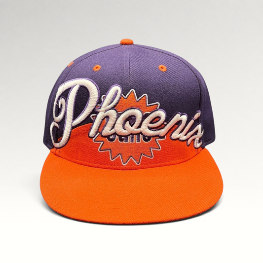 Raree Finds Phoenix Suns Hardwood Classics snapback hat with purple crown, orange brim, and script embroidery.