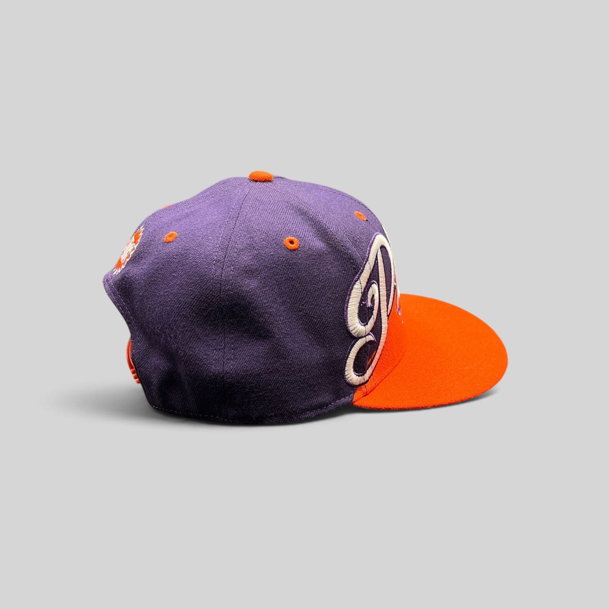 Raree Finds Phoenix Suns ’47 Brand Hardwood Classics snapback hat with purple crown, orange brim, and script logo.