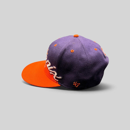 Raree Finds Phoenix Suns ’47 Brand Hardwood Classics snapback hat with purple crown, orange brim, and script logo.