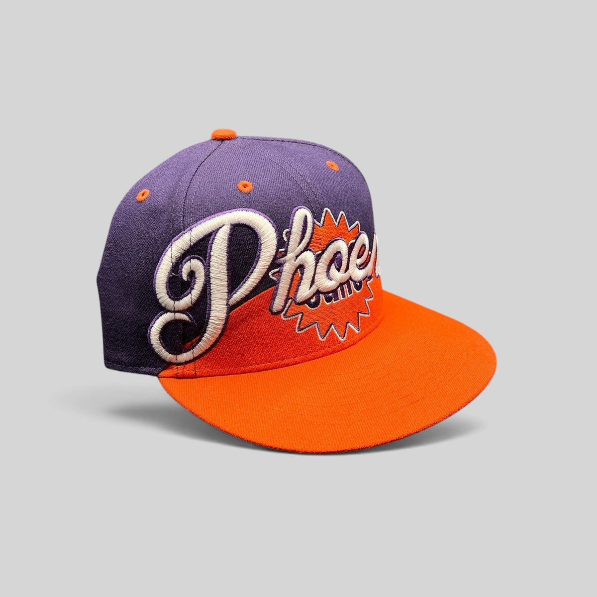 Raree Finds Phoenix Suns Hardwood Classics snapback hat with purple crown, orange brim, and embroidered script logo.