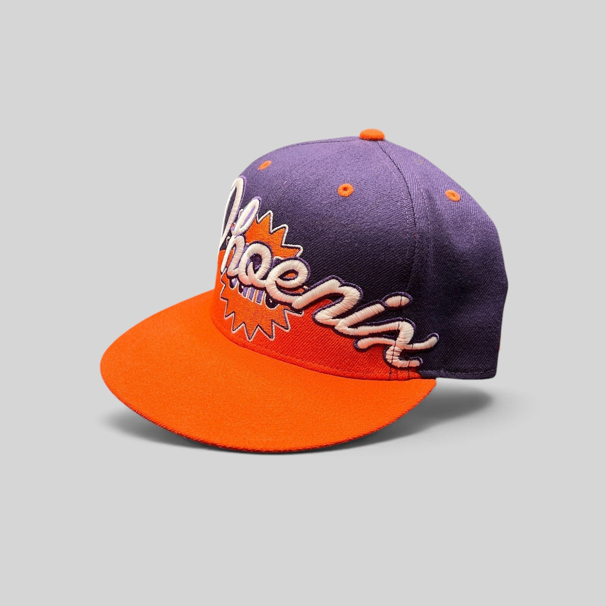 Raree Finds Phoenix Suns Hardwood Classics snapback hat with purple crown, orange brim, and embroidered script logo.