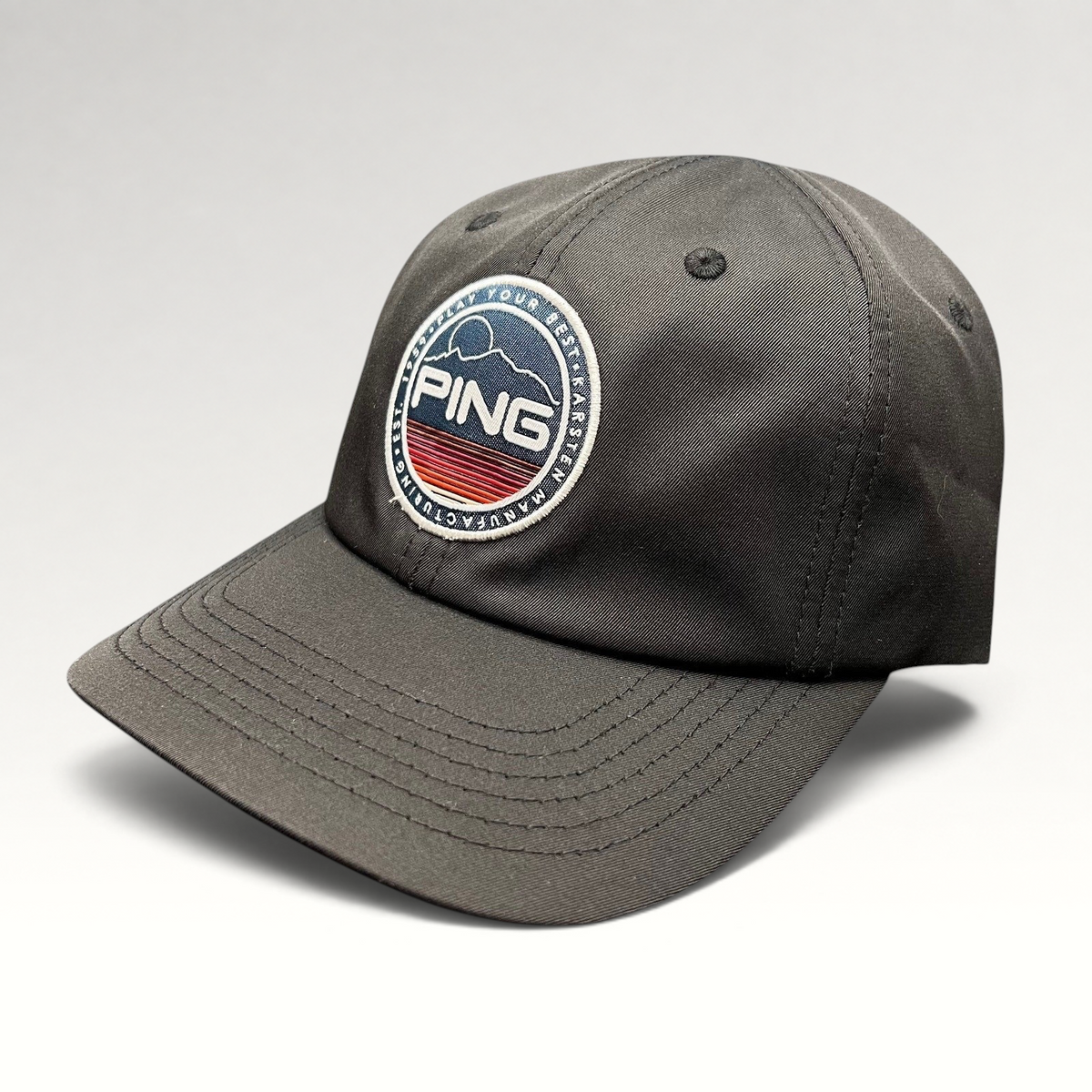 Raree Finds black PING golf strapback hat featuring a circular embroidered mountain patch logo and SensorCool fabric.