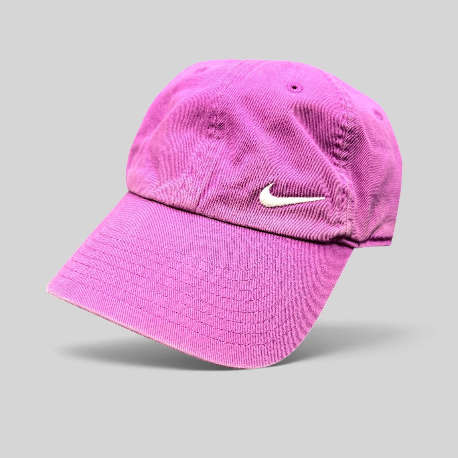 Raree Finds pink Nike Heritage86 cotton twill strapback hat with an embroidered white Swoosh logo and curved brim.