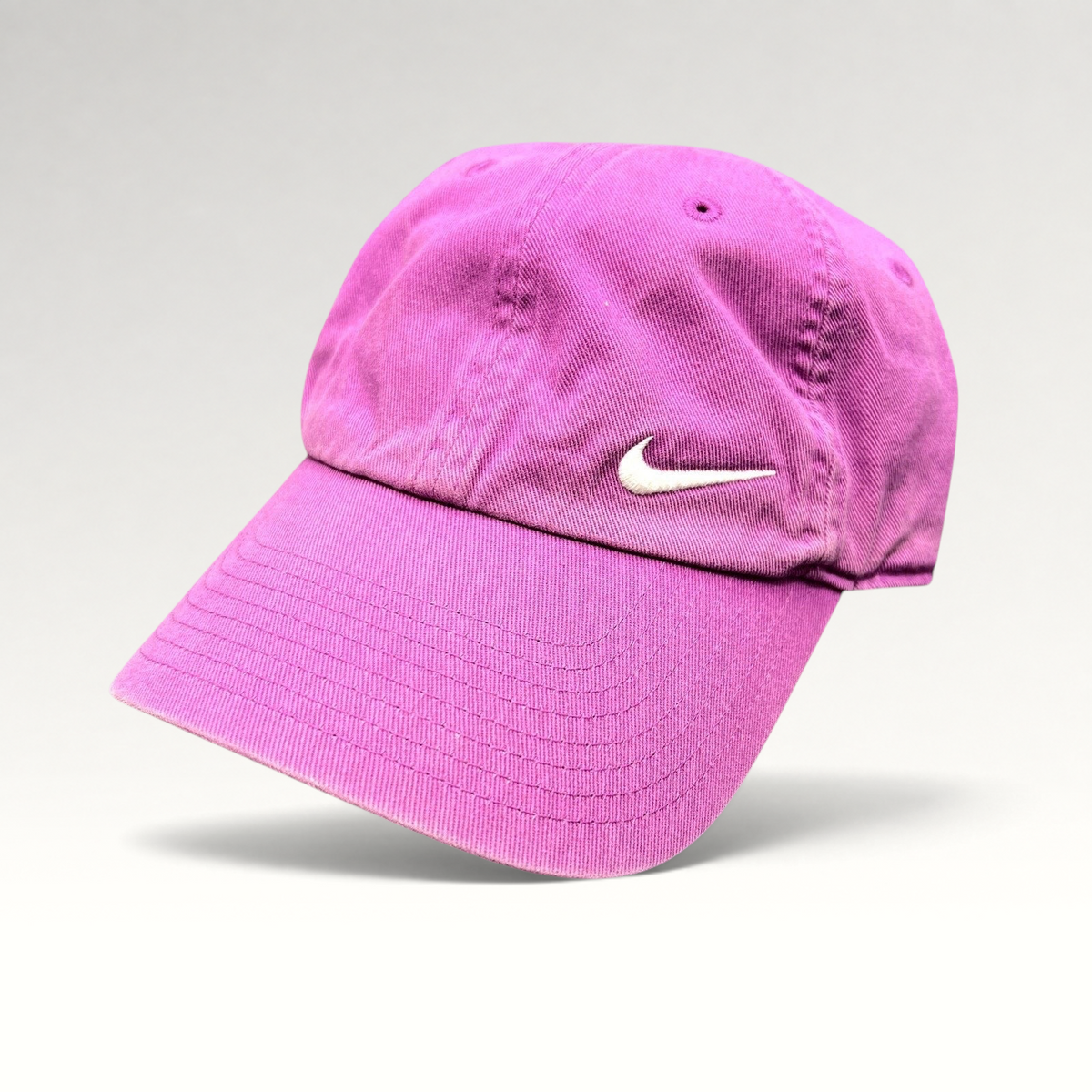 Raree Finds pink Nike Heritage86 cotton twill strapback hat with an embroidered white Swoosh logo and curved brim.