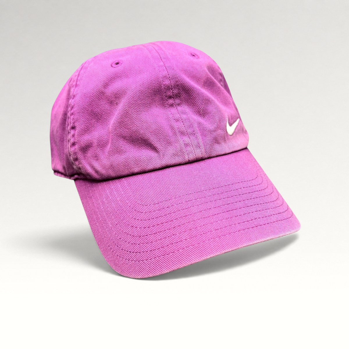 Raree Finds Nike Heritage86 pink cotton twill strapback hat with an embroidered white Swoosh logo and curved brim.