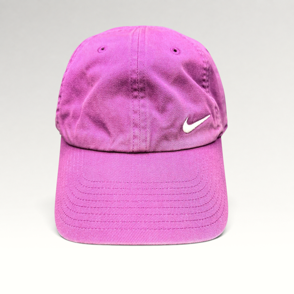 Raree Finds Nike Heritage86 pink cotton twill strapback hat with an embroidered white Swoosh logo and curved brim.