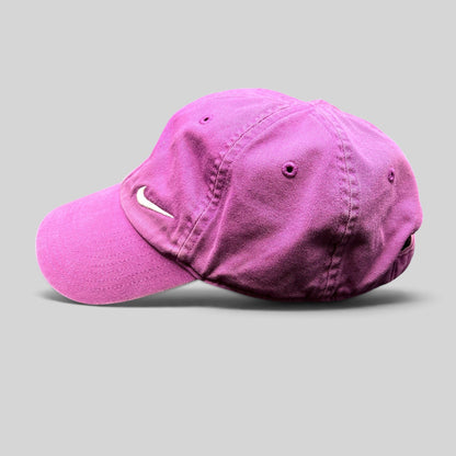 Raree Finds pink Nike Heritage86 cotton twill strapback hat with a white embroidered Swoosh logo and curved brim.