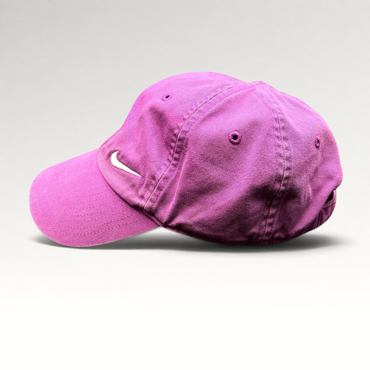 Raree Finds pink Nike Heritage86 cotton twill strapback hat with a white embroidered Swoosh logo and curved brim.