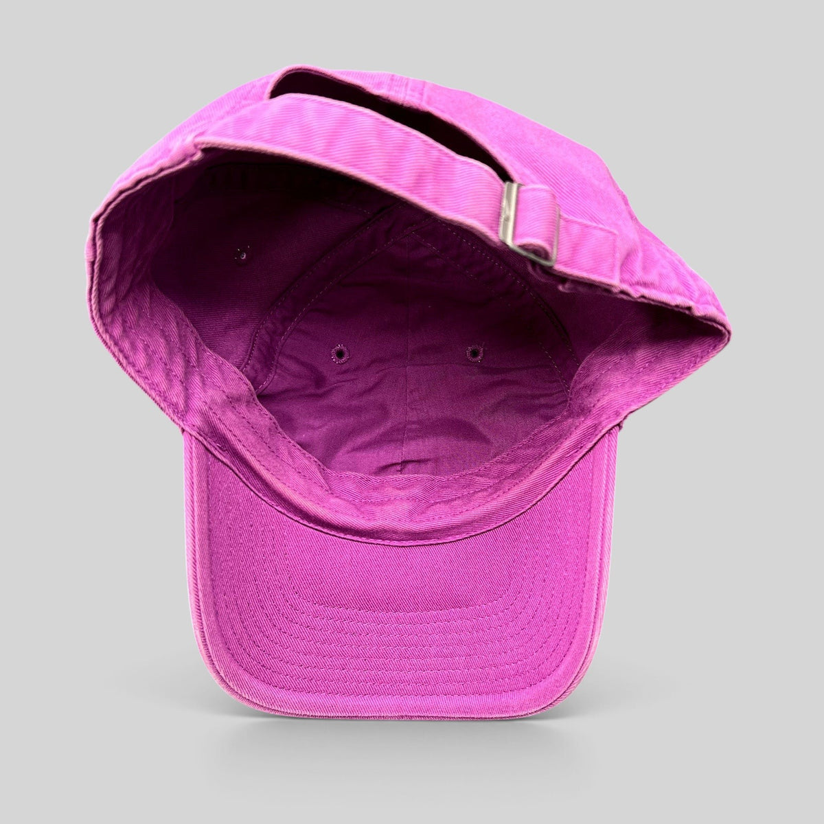 Raree Finds Nike Heritage86 pink cotton twill strapback hat showing the interior construction and adjustable strap