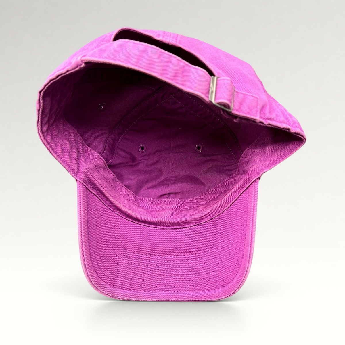 Raree Finds Nike Heritage86 pink cotton twill strapback hat showing the interior construction and adjustable strap