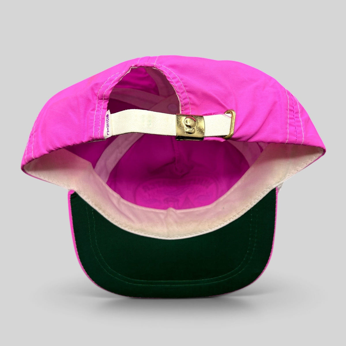 Raree Finds vintage Imperial neon pink nylon strapback hat with green undervisor and adjustable metal buckle closure