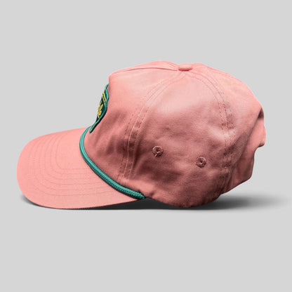 Raree Finds pink strapback hat with teal rope detail and Humble Sea Brewing patch, side profile view.