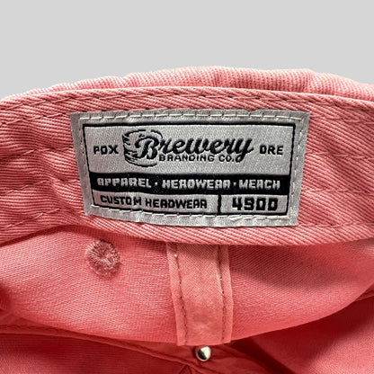 Raree Finds pink cotton strapback hat interior featuring a Brewery Branding Co woven label on the crown