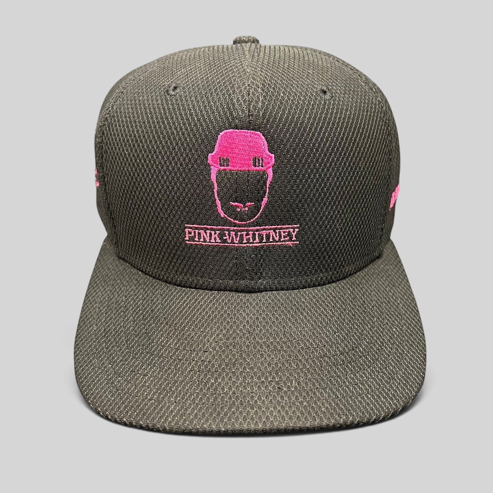 Raree Finds black New Era 9FIFTY snapback hat with pink Pink Whitney logo embroidery and structured flat brim