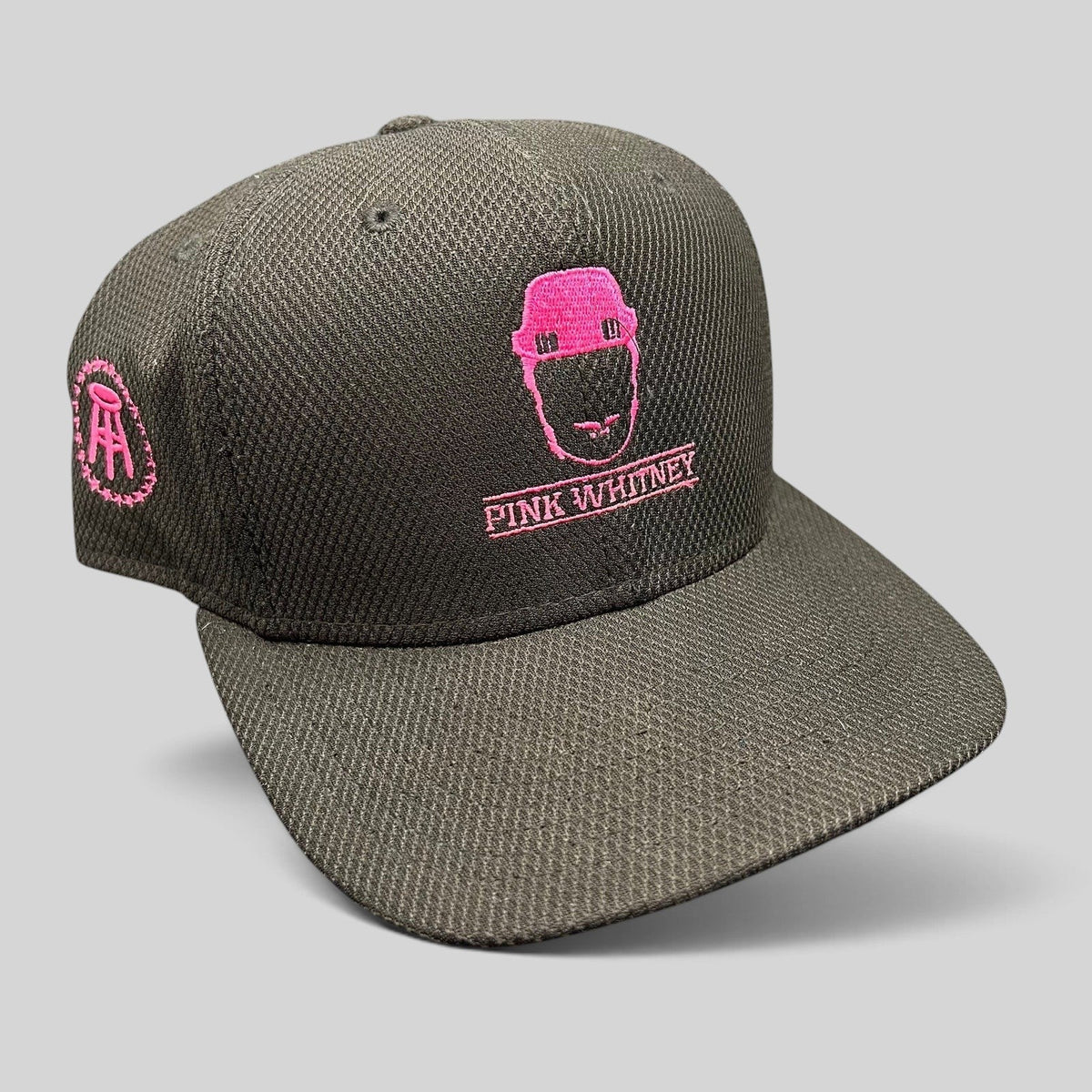 Raree Finds black New Era 9FIFTY snapback hat with pink Pink Whitney logo embroidery and side Barstool stool icon