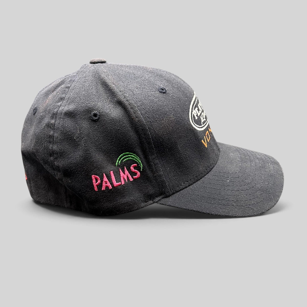 Raree Finds black Playboy Racing Flexfit hat with Vonage and Palms Casino embroidery, side view.