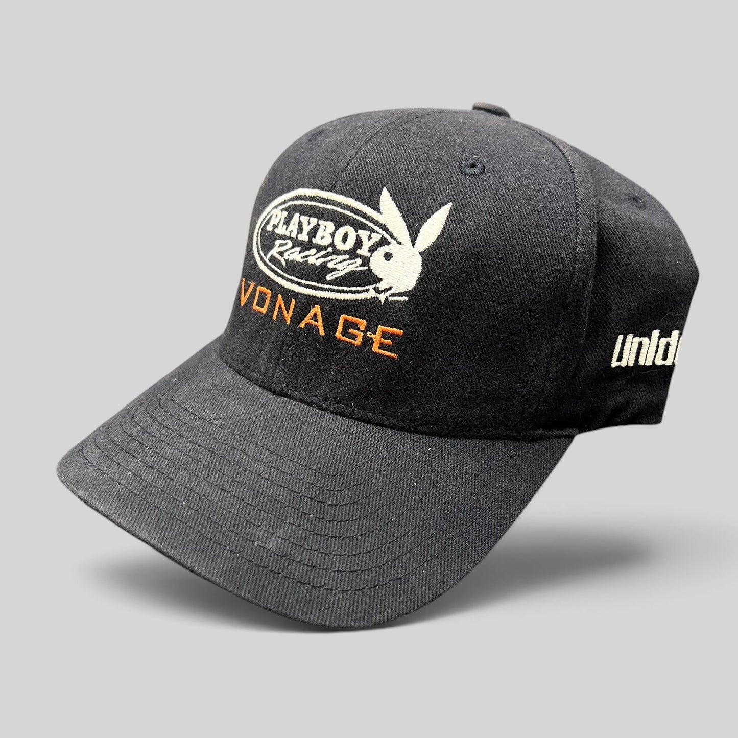 Raree Finds black Yupoong Flexfit hat featuring embroidered Playboy Racing and Vonage logos from the early 2000s.