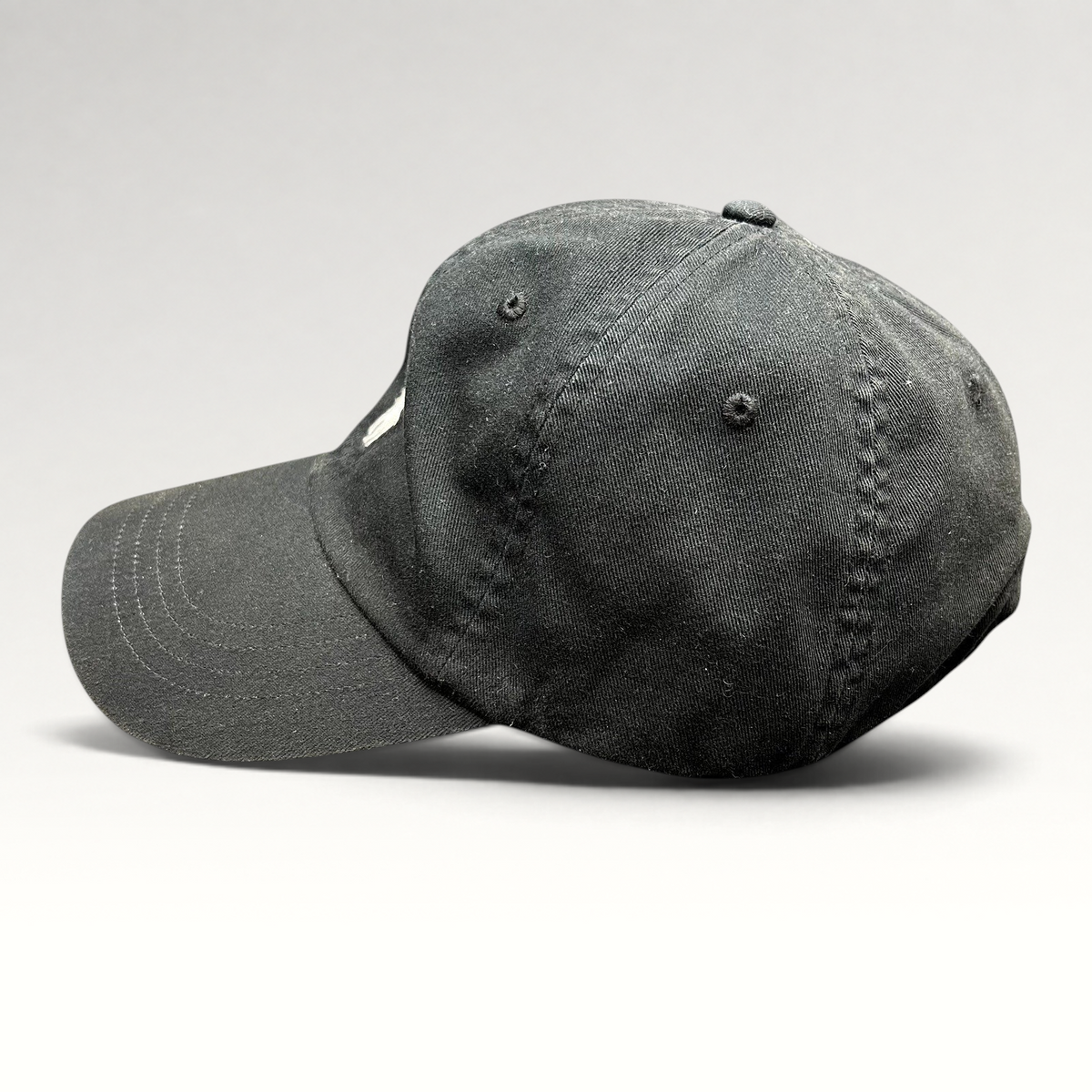 Raree Finds Polo Ralph Lauren black cotton twill strapback hat with white embroidered pony logo, side profile view.